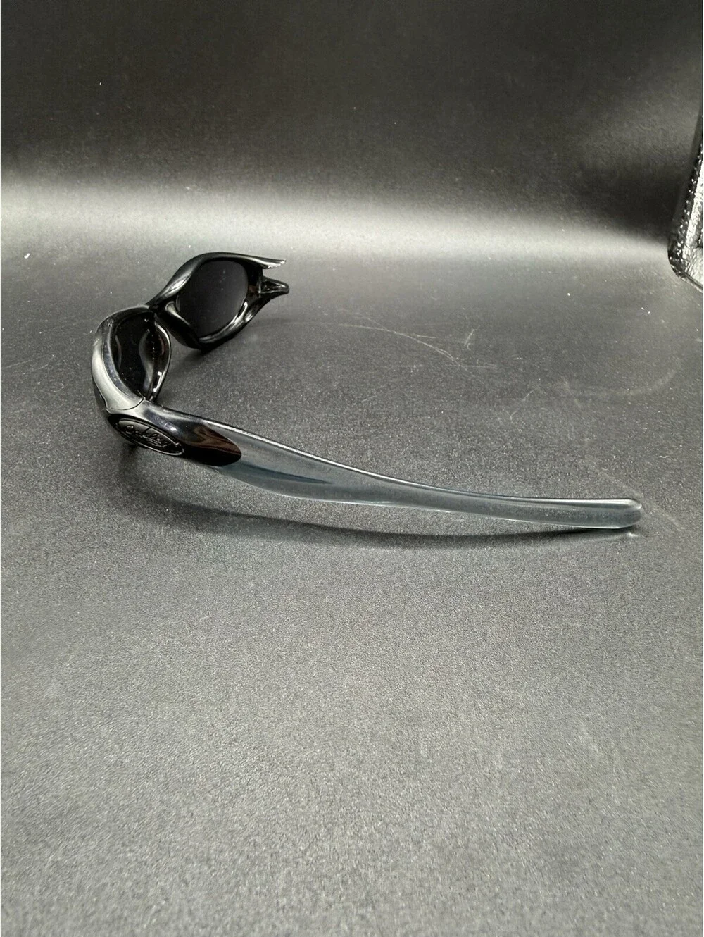 Oakley Pocket Polished Black/Black Iridium Lenses (Missing Right Arm)